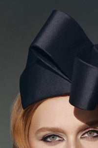NIGHT AND THE CITY black asymmetric bow pillbox hat