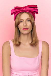 BISOU fuchsia silk bow headband on a model, front view